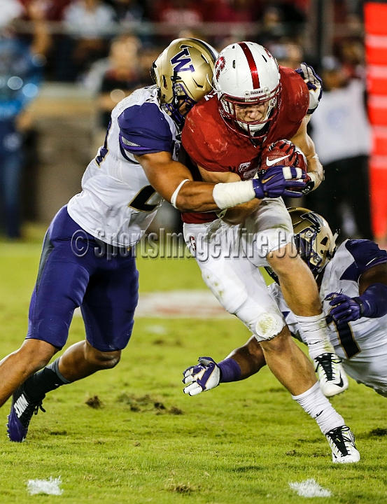 2015StanWash-047.JPG - Oct 24, 2015; Stanford, CA, USA; Stanford Cardinal running back Christian McCaffey (5) is tackled by defensive back Ezekeil Turner (24) in the second quarter against the Washington Huskies at Stanford Stadium. Stanford beat Washington 31-14.